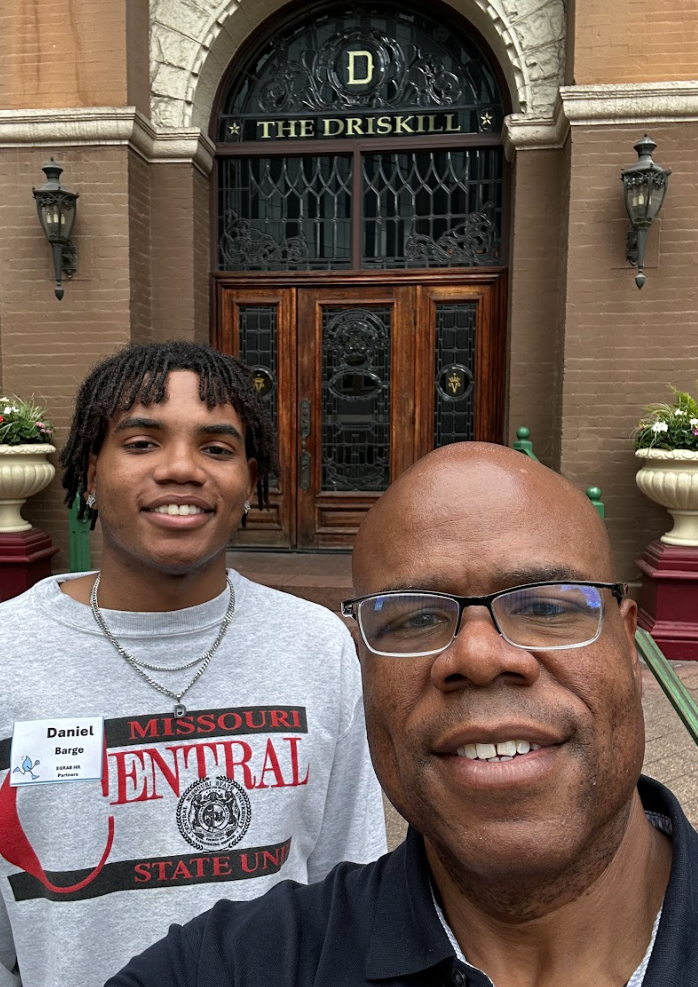 Water Trotter participants taking a picture in front of an Austin landmark